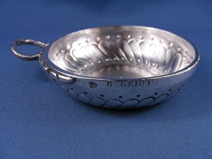 Louis XV/Louis XVI silver wine taster, circular with reeded spiral decoration and hoop handle